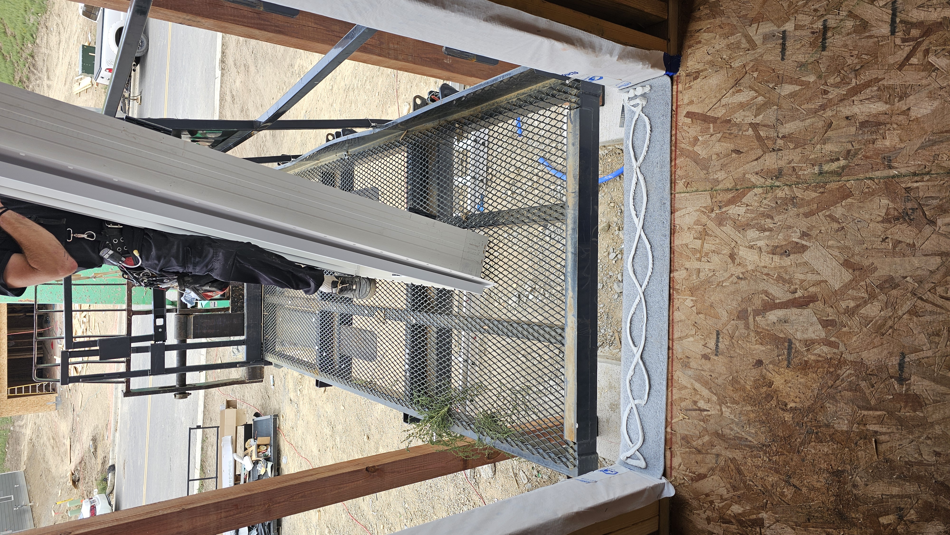 New construction exterior entry door being installed